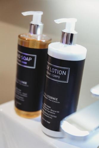 two bottles of hair products sitting on a counter at L Atelier by VIP in Saint Die
