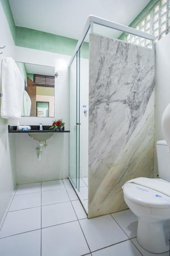 a bathroom with a shower and a toilet at Valencia Hotel Natal in Natal