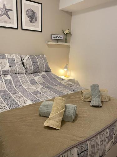 a bedroom with a bed with pillows on it at Sesimbra Fé House in Sesimbra