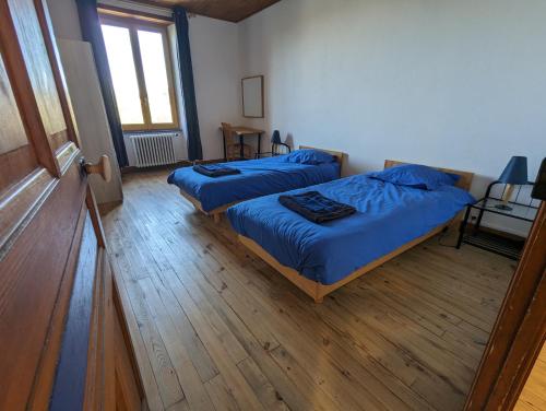 Postel nebo postele na pokoji v ubytování Gite des Vellavi