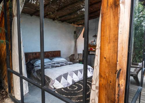 a bedroom with a bed inside of a house at Cabañas de montaña en Chía - Satorinatural in Chía