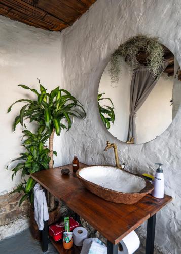 a bathroom with a large sink and a mirror at Cabañas de montaña en Chía - Satorinatural in Chía
