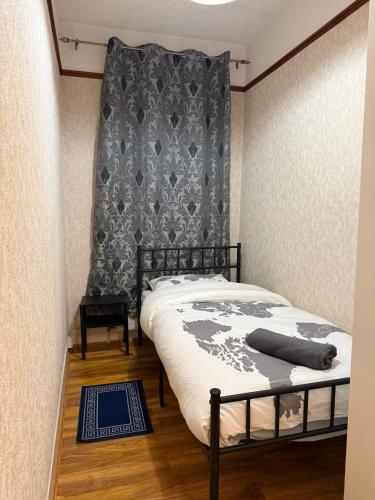 a bedroom with a bed with a map on it at Baraka Altmore in London