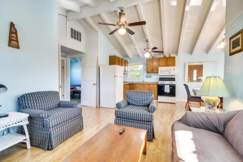 a living room with two chairs and a couch at 5 Mi to Beach Bay St Louis Home with Launch and Dock in Shoreline Park