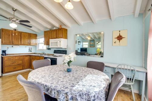 a kitchen and dining room with a table and chairs at 5 Mi to Beach Bay St Louis Home with Launch and Dock in Shoreline Park
