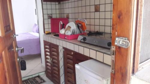 a kitchen with a counter with a appliance on it at The New Big Tree Beach Resort in Mombasa