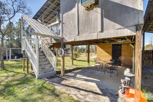 a wooden house with a staircase leading up to it at Studio about 5 Mi to Waveland Beach and Pier! in Shoreline Park