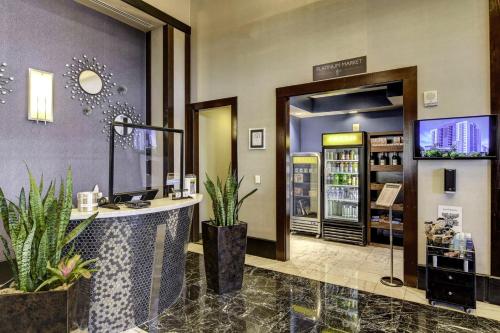 a store with a counter with plants in a room at SPHERE IN 4K - Vintage Vegas Condo with Sphere and Strip Views! in Las Vegas