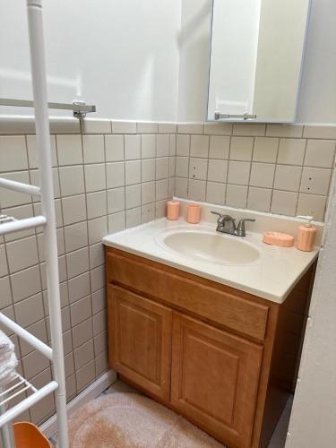 a bathroom with a sink and a mirror at Beautiful House for Rent in Philadelphia