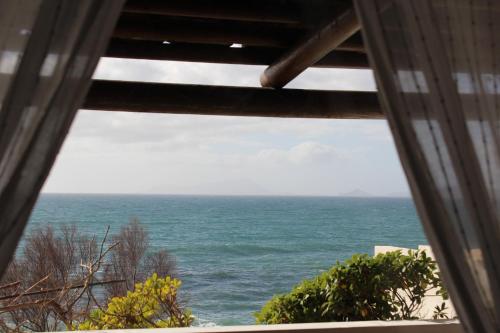 a view of the ocean from a window at Puntaquattroventi in Ercolano