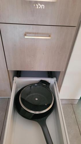 a bathroom with a black toilet in a cabinet at Jerusalem Center in Jerusalem