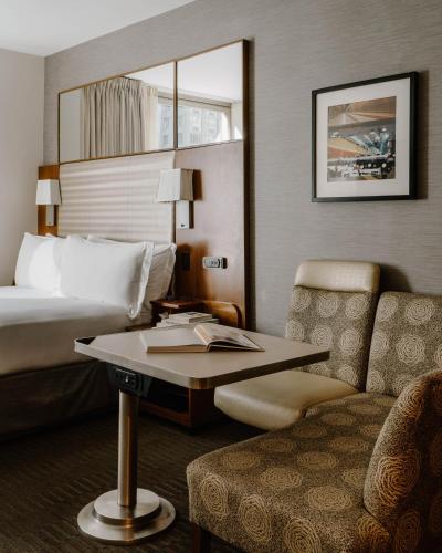 a hotel room with a bed and a table and a chair at Hotel Boutique at Grand Central in New York