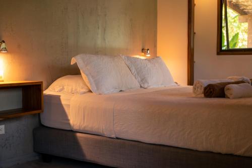 Ein Bett oder Betten in einem Zimmer der Unterkunft Feeling Trees Jungle Lodge