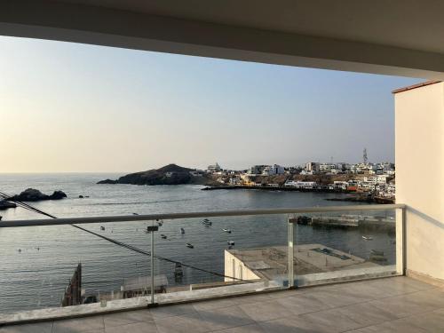 a view of the ocean from the balcony of a house at Mirador del sur in San Bartolo