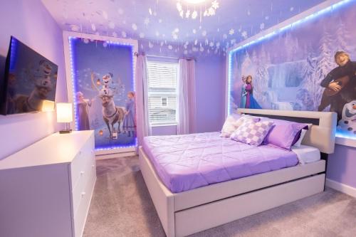 a bedroom with purple walls and a bed in a room at 2901 SS Discover Opulence 4-Bedroom Villa with Pool, and Magical Themed Rooms! in Kissimmee