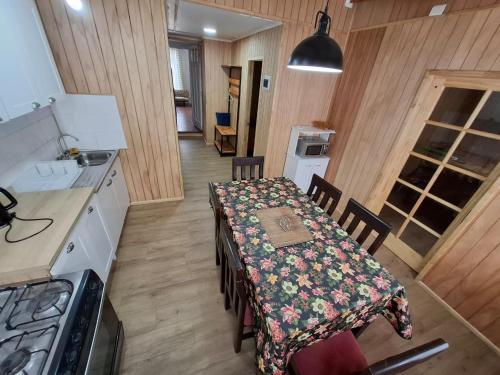 a kitchen with a table with a table cloth on it at Casa Bellavista Tome, hasta 10 personas in Tomé