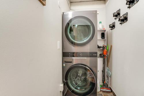 a washer and dryer in a room at Frisco Condo with Pool Access Walk to Main Street! in Frisco