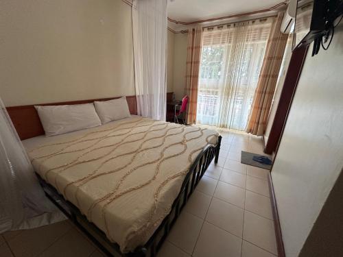 Ένα ή περισσότερα κρεβάτια σε δωμάτιο στο Hotel Alvers