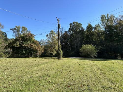 an open field with a telephone pole in it at The Little Lodge Knoxville in Knoxville
