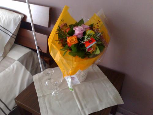 a bouquet of flowers in a vase on a table at B&B Villa Fernadine in De Haan
