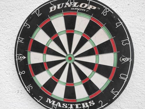 a close up of a dartboard on a wall at Inn-side ADVENTURE CABINS in Haiming