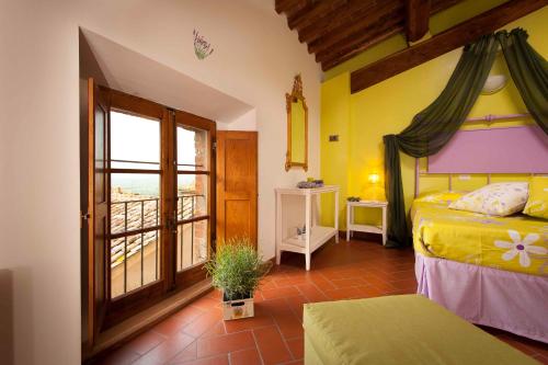 Двухъярусная кровать или двухъярусные кровати в номере Antico Granaione
