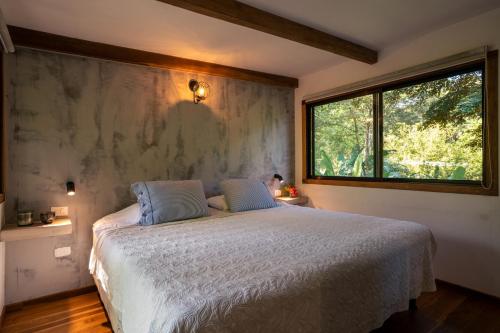 Ein Bett oder Betten in einem Zimmer der Unterkunft Feeling Trees Jungle Lodge