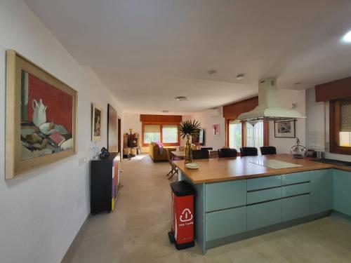 a kitchen with blue cabinets and a counter top at Casa Nieves in Roquetas de Mar