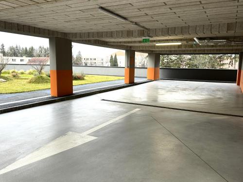 an empty parking garage with an empty parking lot at 4FriendsBrasov K1256 in Braşov