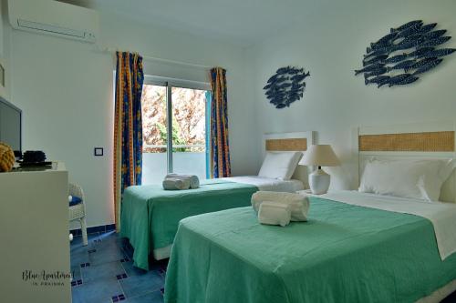 Ένα ή περισσότερα κρεβάτια σε δωμάτιο στο Blue Apartment in Prainha