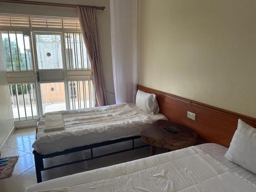 Ένα ή περισσότερα κρεβάτια σε δωμάτιο στο Hotel Alvers