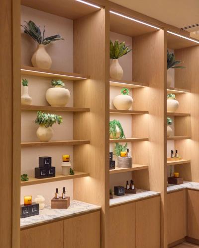 a room with shelves with potted plants on them at Arlo Washington DC in Washington