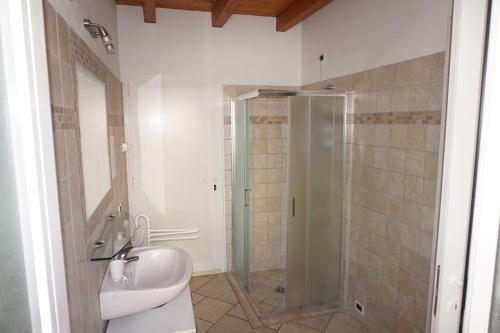 a bathroom with a shower and a toilet and a sink at Bergamum F.L. in Bergamo