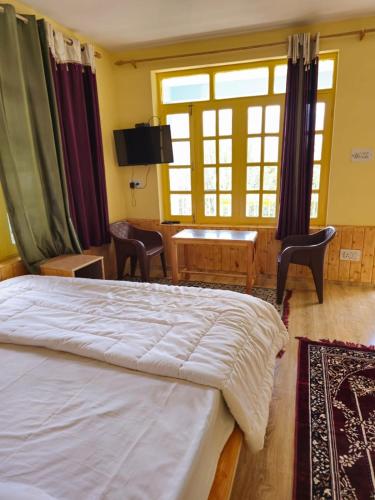 Postel nebo postele na pokoji v ubytování Hotel Dhungri valley