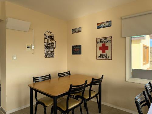 a dining room with a table and chairs at Posada Ruta 40 in Monte Dinero