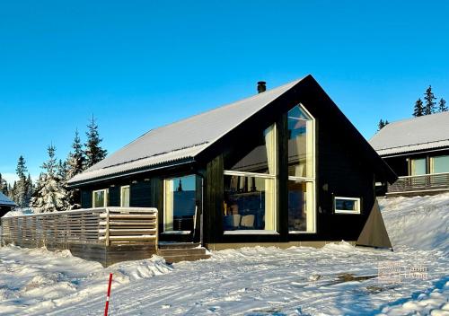 Το Cozy cabin on Sjusjølia by the trail network sauna τον χειμώνα