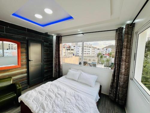 Ένα ή περισσότερα κρεβάτια σε δωμάτιο στο Hôtel Les Mamelles
