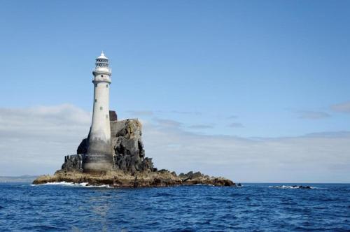 a lighthouse on an island in the ocean at Melrose Bed and Breakfast in Clonakilty