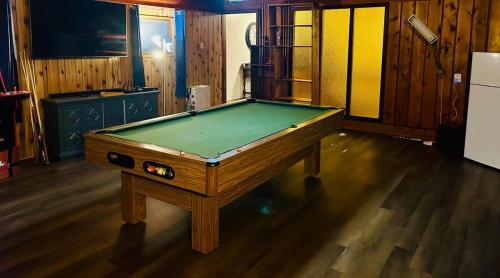 a pool table sitting in a room with at Alaska Getaway in Palmer