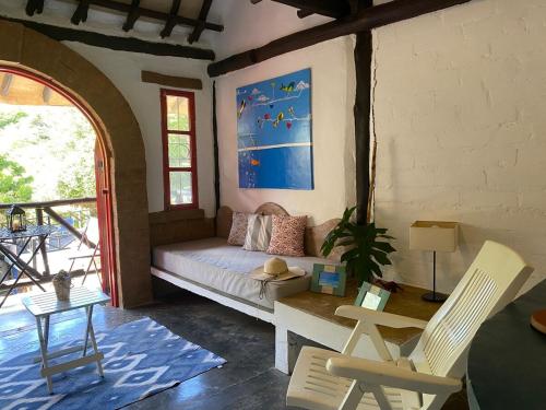a living room with a couch and a table at Relax at Beautiful Townhouse in Guarame in Guarame