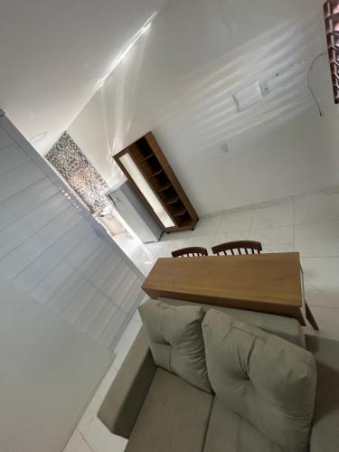 a living room with a table and a couch at Residencial Salinas in Tibau