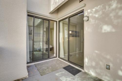 an empty room with glass doors on a house at Downtown San Diego Condo 1 Mi to Gaslamp Quarter in San Diego