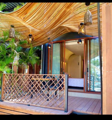 a house with a gate in front of a porch at Playa Vikingos Tequesquitengo in Cuernavaca