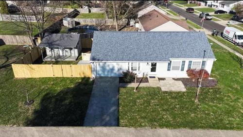 an aerial view of a white house with a yard at Private Ranch - Entire Home - 3 Bed Room - Hot Tub - King Bed - Fenced Yard - Pets & Kids Welcome - Game Shed - Free WiFi in Columbus