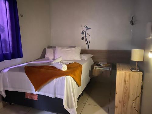 Ένα ή περισσότερα κρεβάτια σε δωμάτιο στο Hotel Xingu