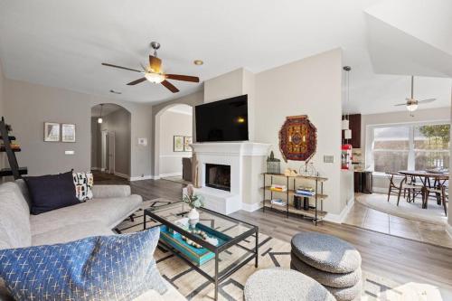 a living room with a couch and a fireplace at Artist Retreat at Cypress Creek - Hotub - Sleeps 9 in Cedar Park