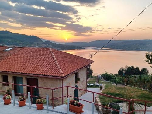 a house with a view of the water at Casa da Ramona in Ribadavia