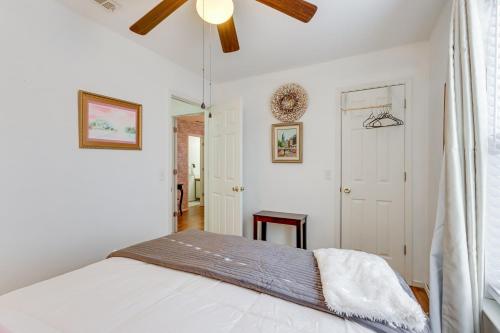 a bedroom with a bed and a ceiling fan at Centrally located in NWA Walk to Wrights BBQ! in Fayetteville