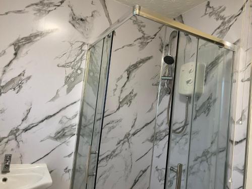 a bathroom with a shower and a sink at Home in Wednesbury