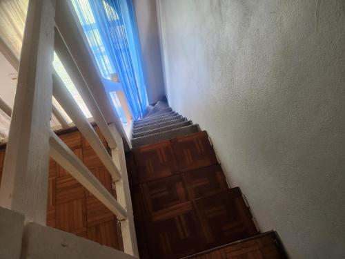 an overhead view of a stairway with a wooden door at Dunn's Apartments at Sandcastles in Ocho Rios